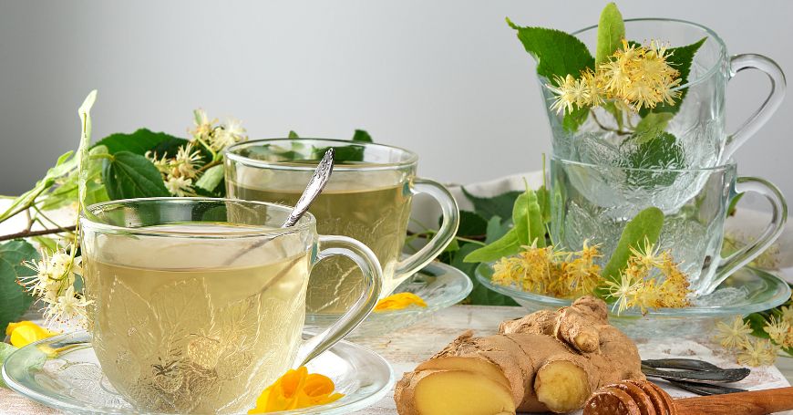 cups of linden tea surrounded by ingredients to prepare it